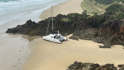Man in 70s swims for nine hours after falling overboard off central Queensland coast