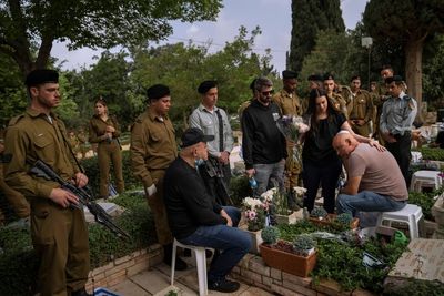 Israel commemorates war dead with nationwide pause, sirens