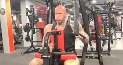 Martyn Ford almost rips huge weights machine off the floor with his 320lb frame