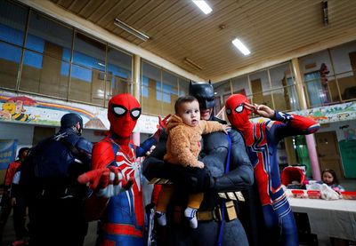 Batman, Princess Elsa and other superheroes visit Argentine prison