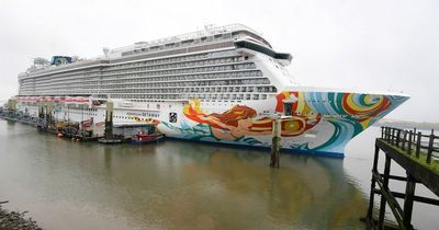 Norwegian Getaway cruise liner with five water slides docked at the waterfront