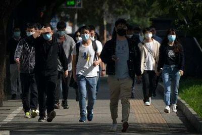 Beijing on high alert for Covid as people return to work after five-day break