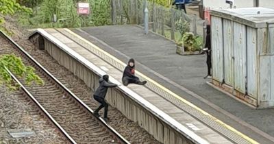 Kids dice with death as they're caught 'playing' on Ayrshire rail track seconds before train charges through station