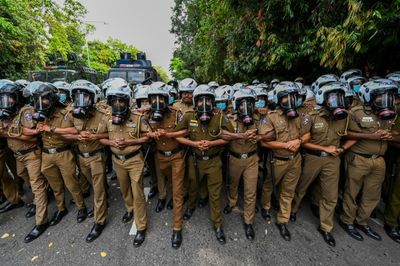 Sri Lanka police tear gas student protesters outside parliament