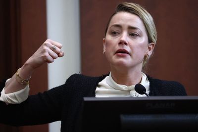 Amber Heard tells court she thought Johnny Depp was going to kill her as trial shown photos of injuries