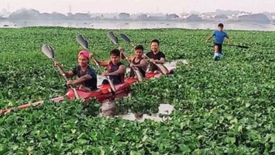 Bengaluru: Kayakers practise in lake filled with weeds, sewage