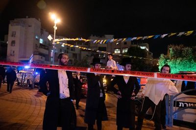 Israel searches for attackers who killed 3 in mass stabbing