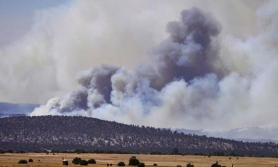 Firefighters slow advance of New Mexico blaze as Biden declares disaster