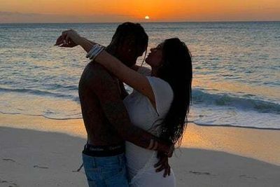 Kylie Jenner and Travis Scott fuel speculation they are engaged as they pose for romantic beach pictures