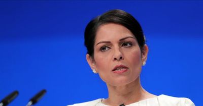 Protesters disrupt Priti Patel speech at Tory dinner over 'racist' Rwanda refugee plan