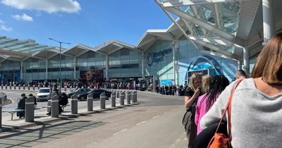 TUI passengers fume in huge Birmingham Airport queue so big it snakes out the front door