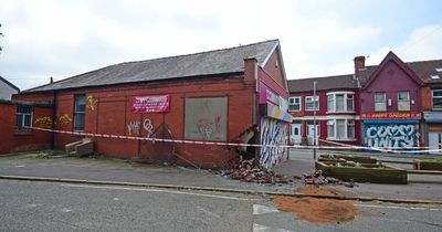 Car ploughs in to community centre in crash forcing Liverpool road to close