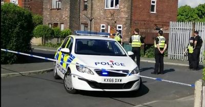 Police cordon off street for hours following reports of group in balaclavas 'fighting with weapons'