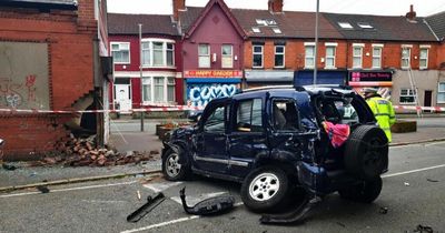 Police update after car smashes in to community centre