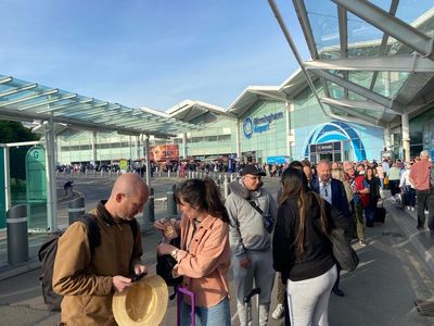 Airline passengers forced to wait outside airport for hours
