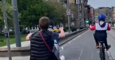 Edinburgh youths perform dangerous wheelies beside tram line on Princes Street