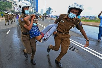 Dozens injured as Sri Lanka government supporters run riot