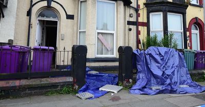 Birthday banner in flats where man fell to his death from a window