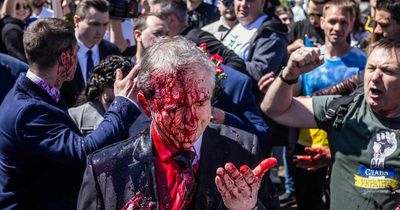 Russian Ambassador covered in blood red paint as protesters chant 'fascists'