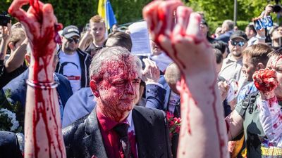 Russia's ambassador to Poland doused in red paint by protesters on V-E Day