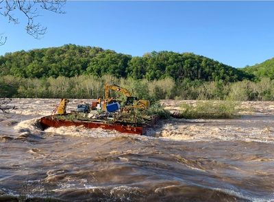 Two barges stuck along Potomac River after heavy rain caused them to break free and float away