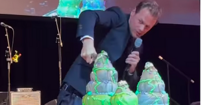 Outlander's Sam Heughan has fans in stitches as he struggles to cut mammoth birthday cake