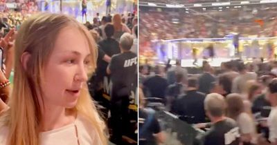 UFC fan shoved to the ground after trying to climb into cage following title fight