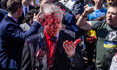 Russian ambassador to Poland pelted with red paint at VE Day gathering