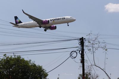 Mexico to cut flights at main airport after near-miss on runway