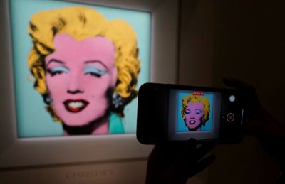 Warhol portrait of Marilyn Monroe fetches record $195m: Christie's