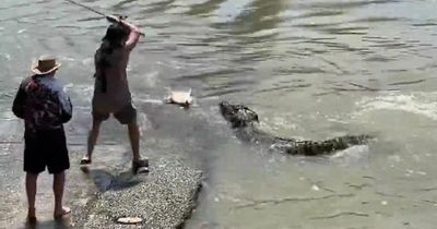 Brave fisherman does battle with 13-foot man-eating crocodile over a FISH