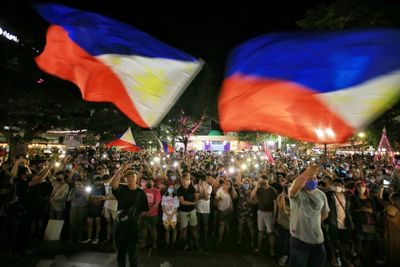 Son of late Philippine dictator wins presidency in landslide