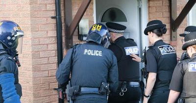 Two quizzed as gun, cocaine and ketamine found in home