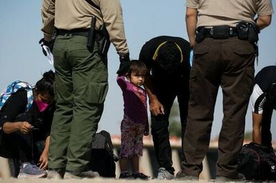 QAnoners are meeting migrant kids at the border and giving them “Let’s Go Brandon” t-shirts