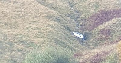 A car precariously wedged on the side of Bwlch mountain for two years has been finally removed