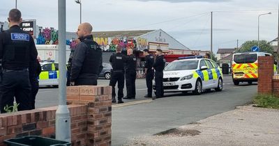 At least 20 police officers and a dozen squad cars descend on Welsh seaside town