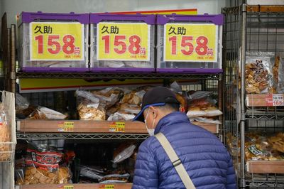 Frugal Japanese tighten their belts as prices rise, yen slides