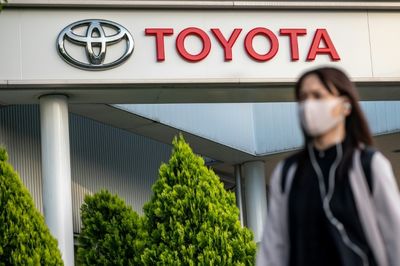 Toyota posts record full-year net profit, forecasts cautious