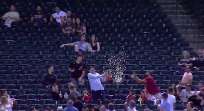 A MLB fan caught a foul ball with his bag of popcorn and made it look so easy