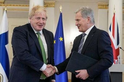 Boris Johnson says Nato poses ‘no threat to anyone’ as Finland and UK sign defence pact