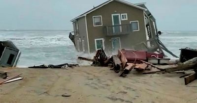 Dramatic footage shows £300,000 house collapsing into the sea during stormy weather