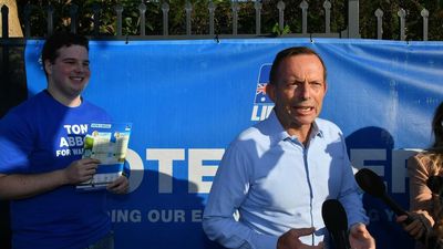 Abbott urges support for embattled Deves