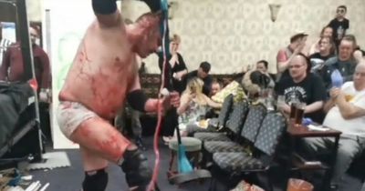 Horror as blood-soaked wrestlers fight in 'death match' in front of families