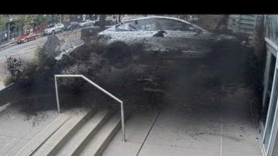 Watch This Tesla Crash Into Convention Center, Driver Error