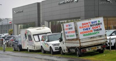 Fuming Range Rover owner parks vehicles covered in angry signs outside Land Rover dealership