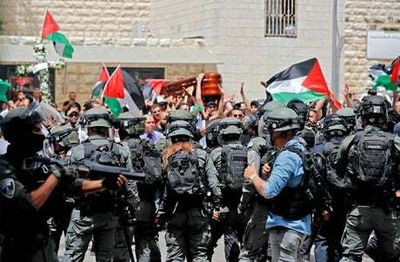 Violent scenes in Jerusalem as mourners gather for funeral of Al Jazeera journalist