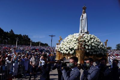 'Not free from COVID': Thousands pray at Portuguese shrine despite fears of new wave