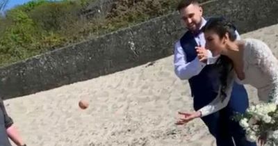 Adorable dog gatecrashes beach wedding to demand game of fetch