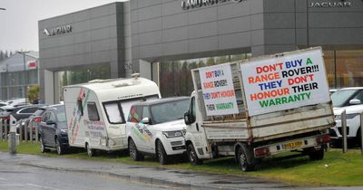 Livid Range Rover owner parks vehicles plastered with angry signs outside dealership in warranty protest