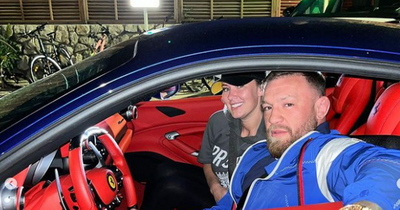 Conor McGregor and Dee Devlin get cosy in Ferrari as glamour holiday continues